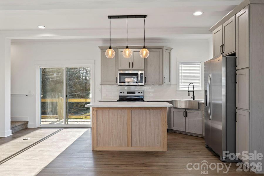 Dining Area w/ sliding glass door to rear West facing Deck