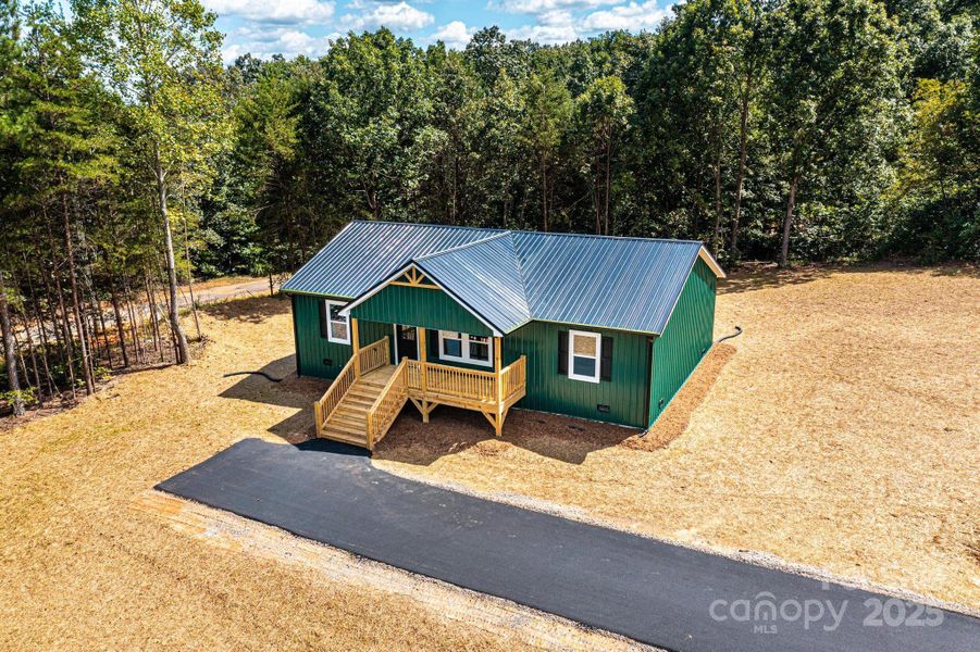 Front exterior of a new home in , Connelly Springs, NC, highlighting curb appeal (Image 1).