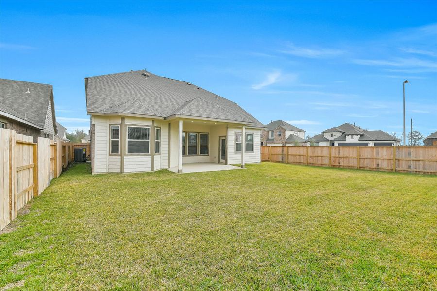Exterior details and patio area of a home in Stone Creek Ranch, Hockley (Image 25).