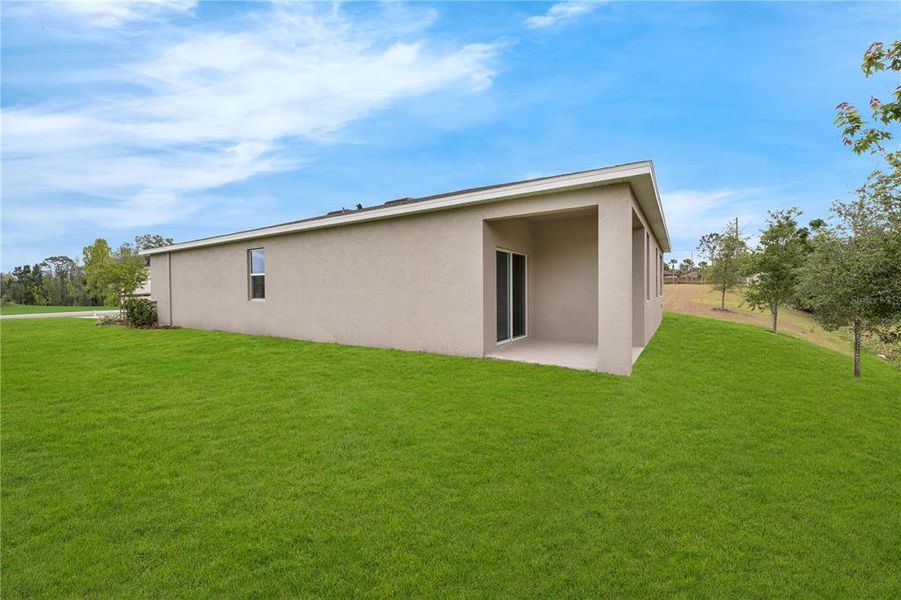 Exterior details and patio area of a home in Covered Bridge at Liberty Bluff, Haines City (Image 3).