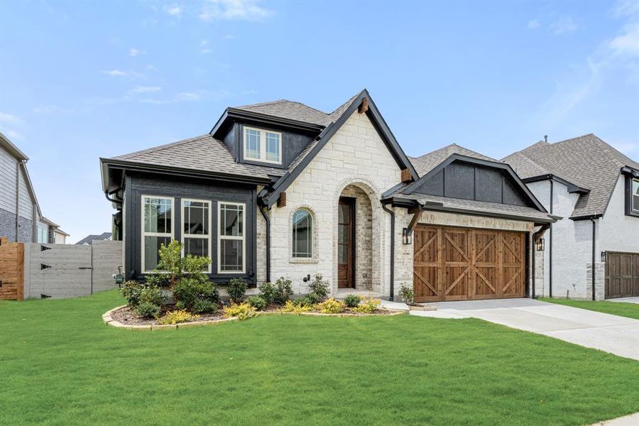 Front exterior of a new home in Painted Tree Woodland District 50, McKinney, TX, highlighting curb appeal (Image 26). Front exterior of a new home in Painted Tree Woodland District 50, McKinney, TX, highlighting curb appeal (Image 26).