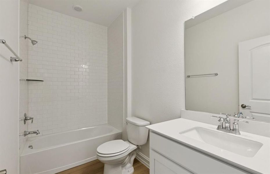 Secondary bathroom featuring modern upgrades and finishes  *Real home pictured