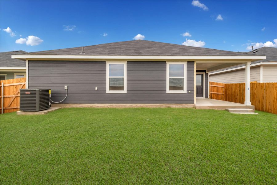 Exterior details and patio area of a home in Monarch Ranch, Manor (Image 19).