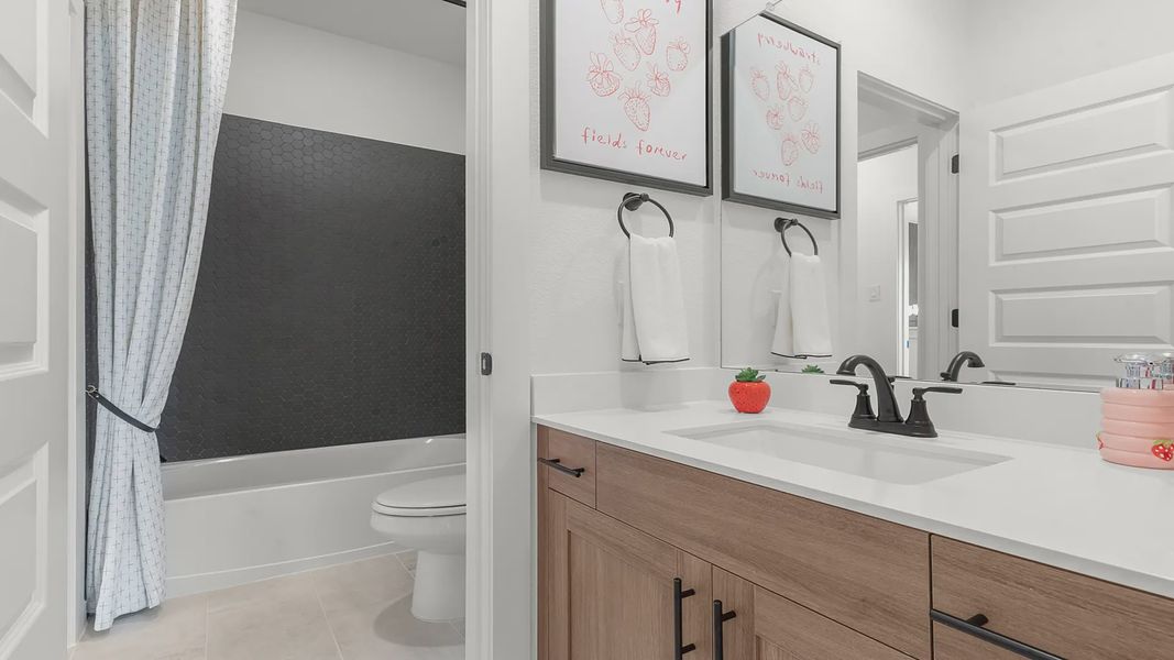 Representative furnished interior of a home built from the Madison by Chesmar Homes in Nolina, Georgetown (Image 28).