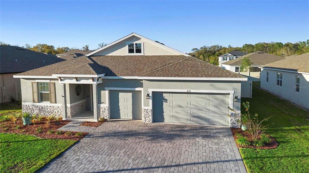 Front exterior of a new home in Addison Landing, Deland, FL, highlighting curb appeal (Image 24).
