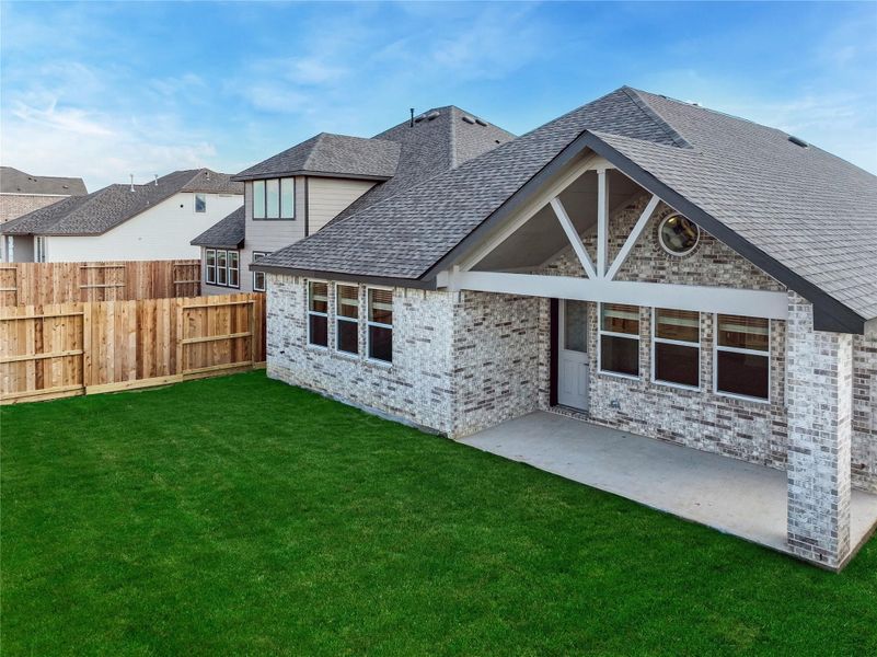 Exterior details and patio area of a home in Oakberry Trails, Waller (Image 3).
