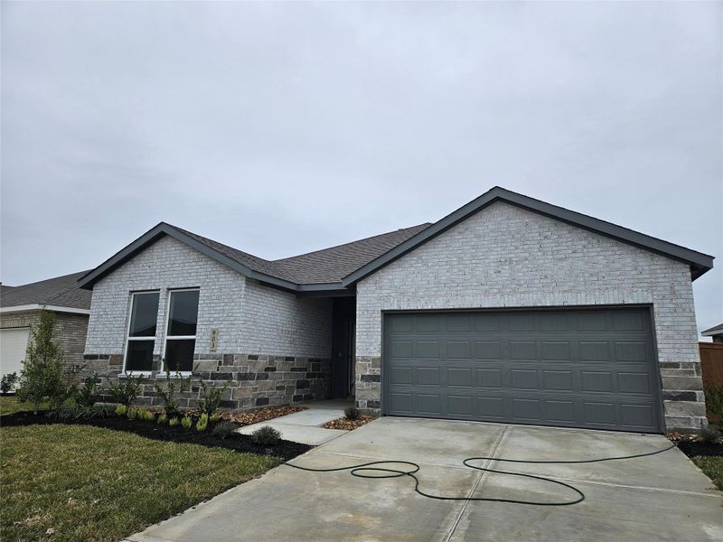 Front exterior of a new home in Pleasant Hill: Classic Collection, Bryan, TX, highlighting curb appeal (Image 18). Front exterior of a new home in Pleasant Hill: Classic Collection, Bryan, TX, highlighting curb appeal (Image 18).