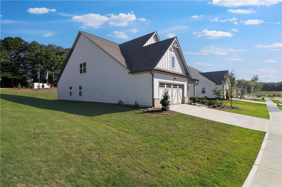 Front exterior of a new home in Twelve Parks 55+, Sharpsburg, GA, highlighting curb appeal (Image 24). Front exterior of a new home in Twelve Parks 55+, Sharpsburg, GA, highlighting curb appeal (Image 24).