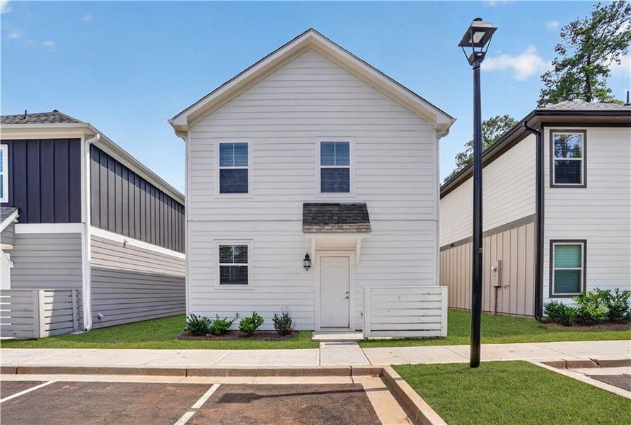 Front exterior of a new home in The Cottages at East Lanier, Fayetteville, GA, highlighting curb appeal (Image 15).