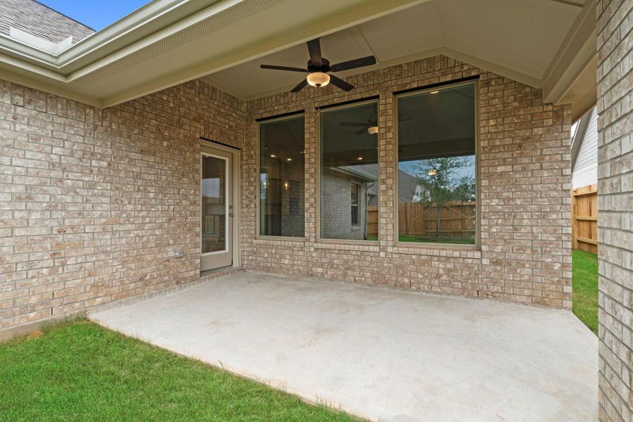 Exterior details and patio area of a home in Wildtree, Magnolia (Image 4).