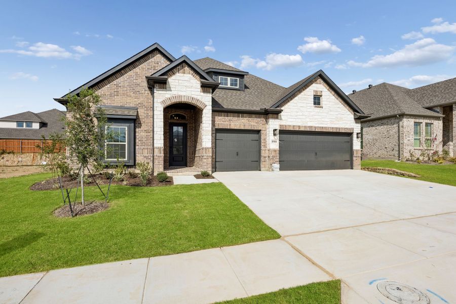 Front exterior of a new home in Country Lakes, Denton, TX, highlighting curb appeal (Image 2). Front exterior of a new home in Country Lakes, Denton, TX, highlighting curb appeal (Image 2).