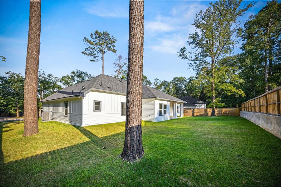 Front exterior of a new home in , Conroe, TX, highlighting curb appeal (Image 23).