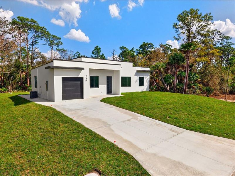 Front exterior of a new home in , Port Charlotte, FL, highlighting curb appeal (Image 24).