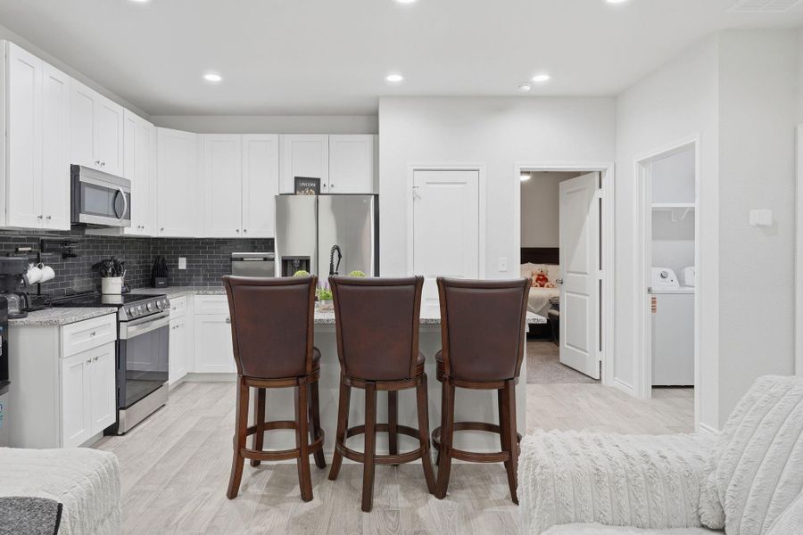 Furnished interior view inside a new home in Arrowhead Lakes, Willis (Image 10).