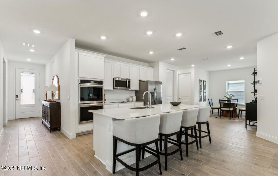 Furnished interior view inside a new home in Edenbrooke at Hyland Trail | 55+: Edenbrooke at Hyland Trail 60s, Green Cove Springs (Image 11).
