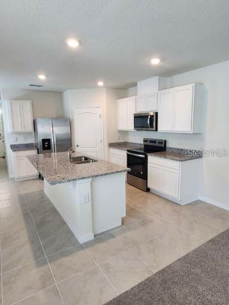 Furnished interior view inside a new home in , Kissimmee (Image 4). Furnished interior view inside a new home in , Kissimmee (Image 4).
