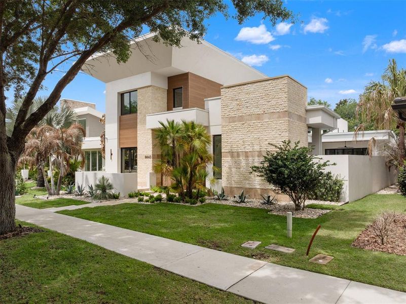 Front exterior of a new home in , Orlando, FL, highlighting curb appeal (Image 25).