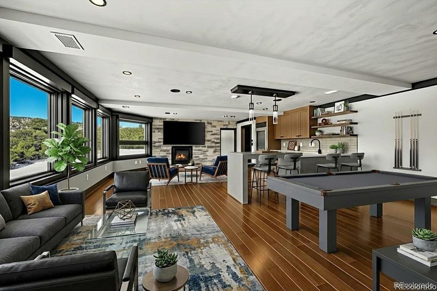 Virtually Staged Lower level recreational room with gas fireplace