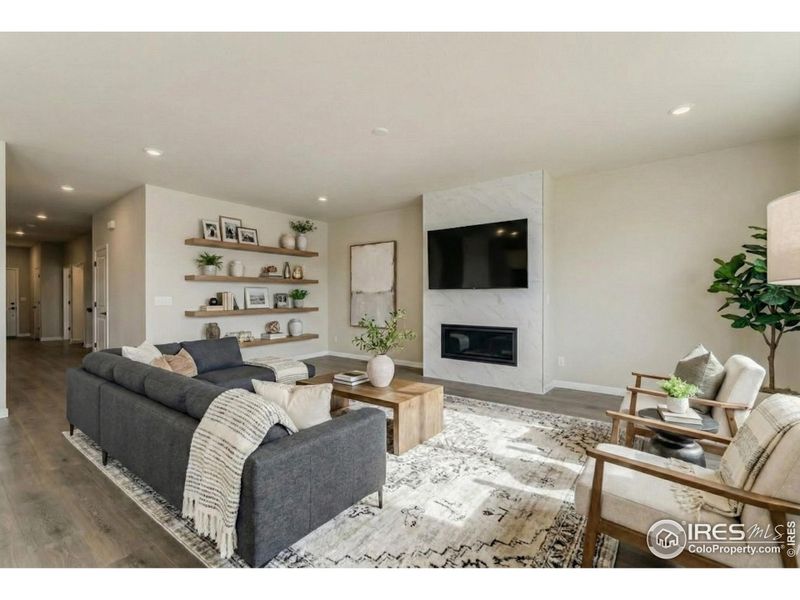 Great room centered by gas fireplace