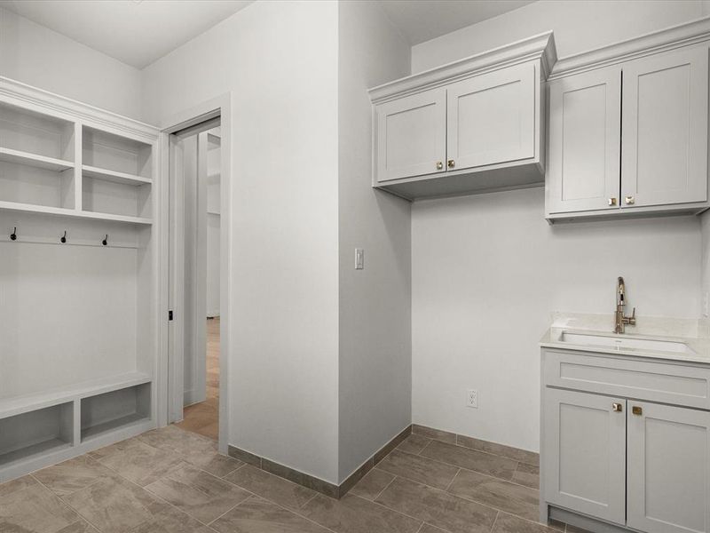 Mudroom featuring baseboards Mudroom featuring baseboards