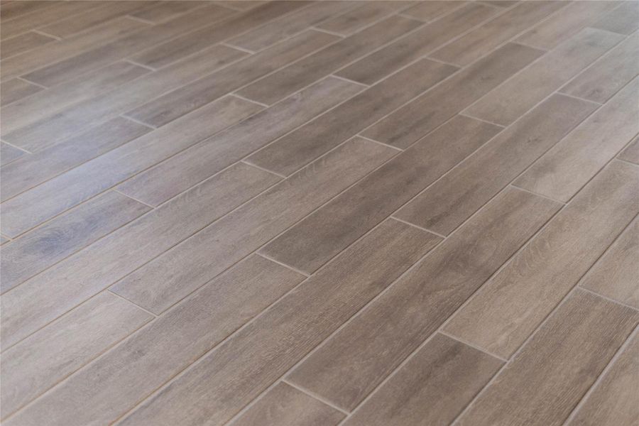 Hill House Natural tile flooring throughout the main living areas.
