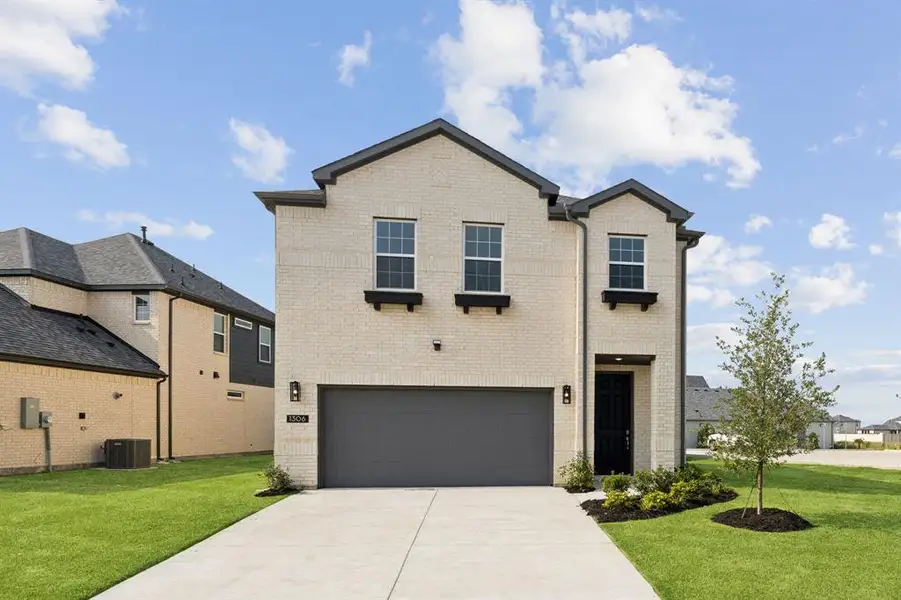 Front exterior of a new home in Bellagio, Forney, TX, highlighting curb appeal (Image 1). Front exterior of a new home in Bellagio, Forney, TX, highlighting curb appeal (Image 1).