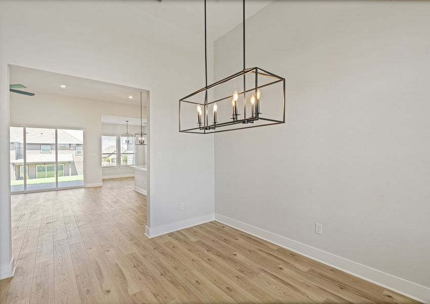 The dining room sits off of the family room and kitchen.