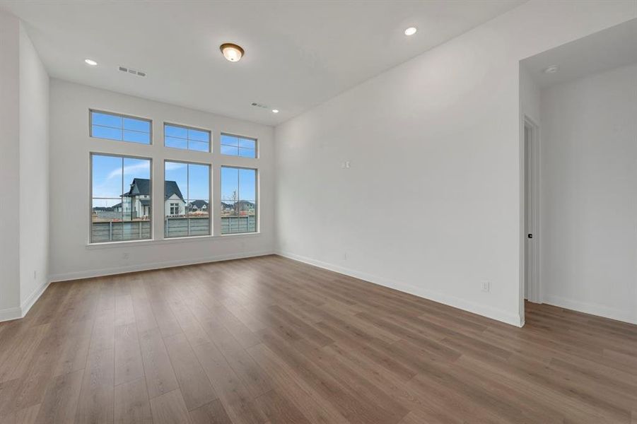 Unfurnished room featuring recessed lighting and dark wood finished floors