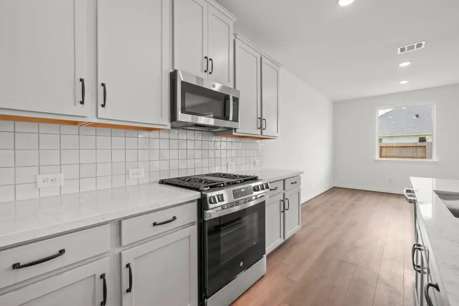 Kitchen. Sample product photo. Actual exterior and interior selections may vary by homesite. Photo may be virtually staged.