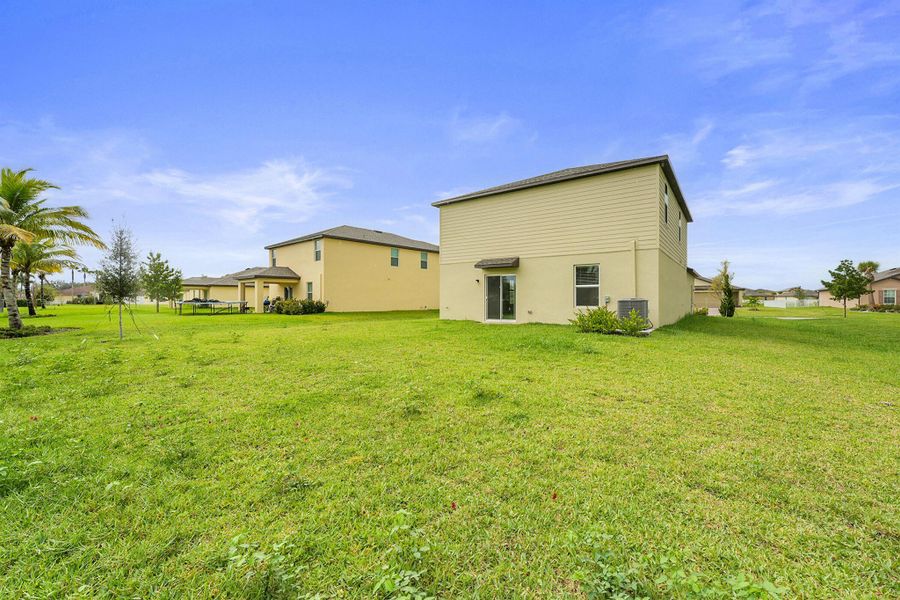 Front exterior of a new home in Bent Creek: The Meadows Collection, Fort Pierce, FL, highlighting curb appeal (Image 16).