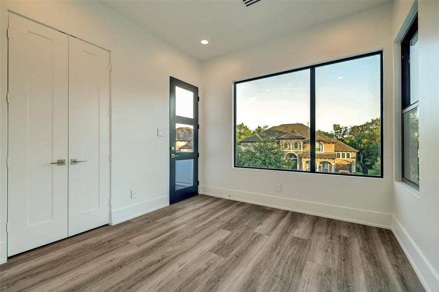 Secondary bedroom with shared access to the balcony.