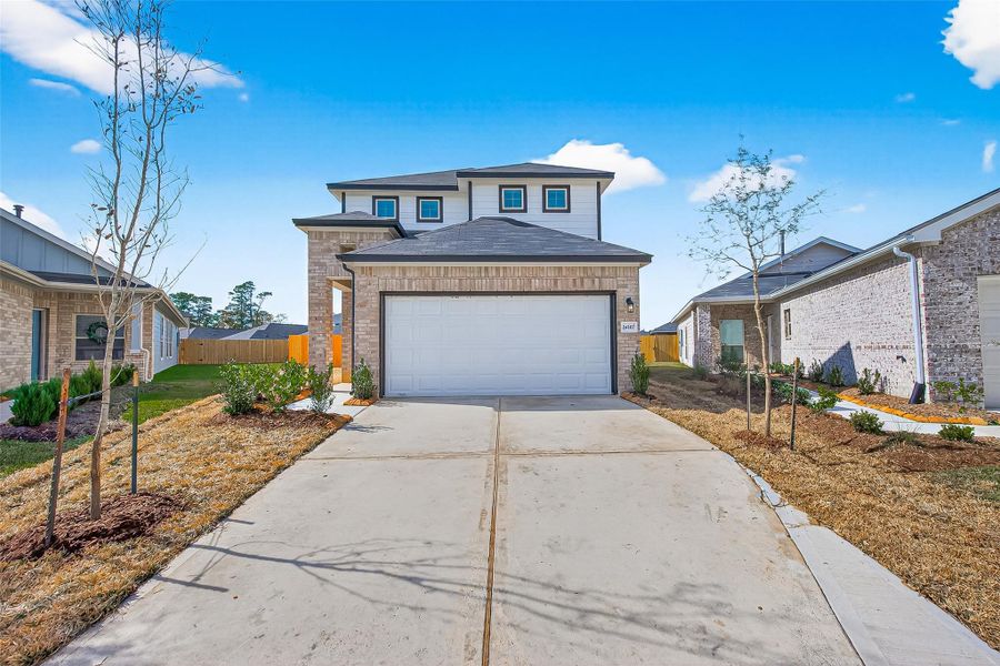 Front exterior of a new home in Woodland Lakes, Houston, TX, highlighting curb appeal (Image 18).