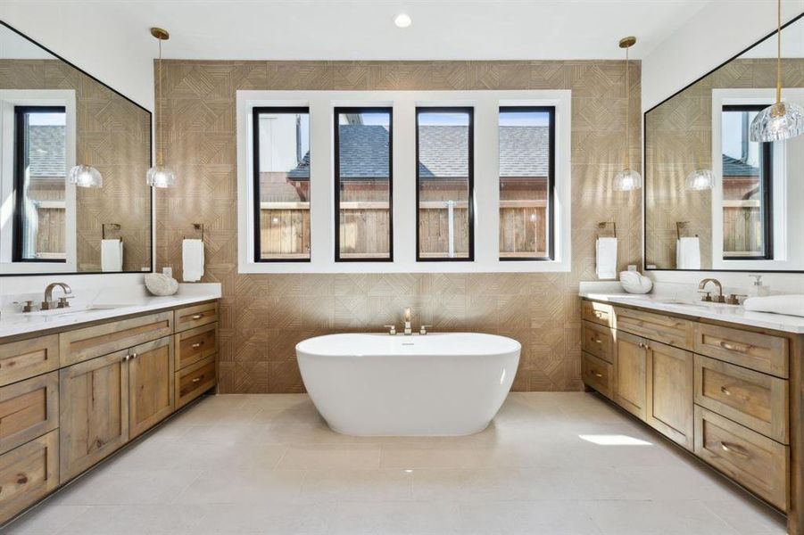 Bathroom with vanity and a tub