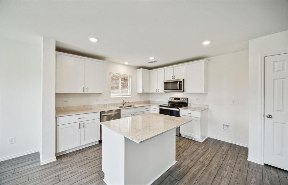 Airy kitchen with ample cabinet space *real home pictured