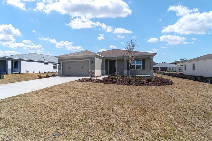 Front exterior of a new home in , Ocala, FL, highlighting curb appeal (Image 19).