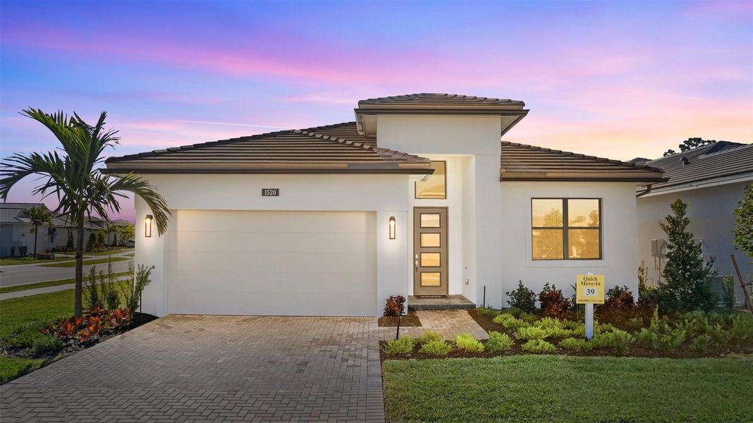 Front exterior of a new home in Cove Royale, Stuart, FL, highlighting curb appeal (Image 24).