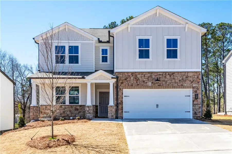 Front exterior of a new home in Cambridge at Steels Bridge: Steels Bridge, Canton, GA, highlighting curb appeal (Image 1).