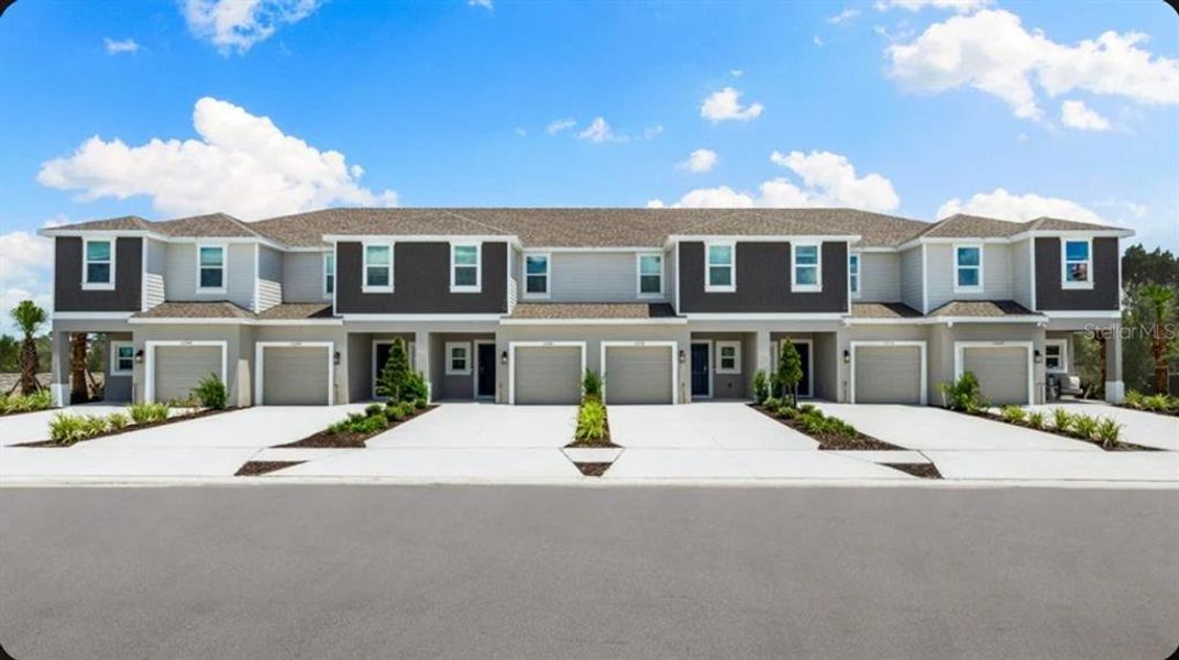 Front exterior of a new home in Skye Ranch Community Group Page, Sarasota, FL, highlighting curb appeal (Image 1). Front exterior of a new home in Skye Ranch Community Group Page, Sarasota, FL, highlighting curb appeal (Image 1).