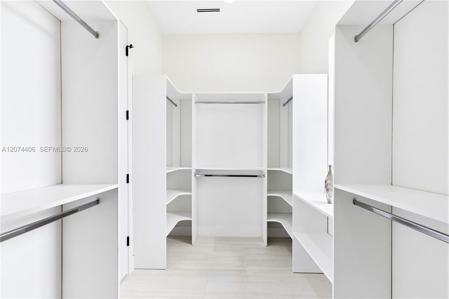 START & END YOUR DAY ORGANIZED w/ an expansive CUSTOM WALK-IN CLOSET offering abundant built-in shelving & hanging space for effortless everyday living! START & END YOUR DAY ORGANIZED w/ an expansive CUSTOM WALK-IN CLOSET offering abundant built-in shelving & hanging space for effortless everyday living!