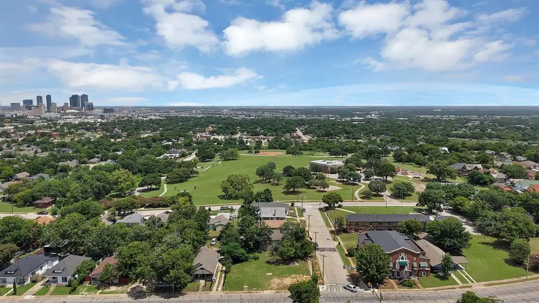 Expansive aerial perspective showcasing a verdant urban landscape with mature tree canopies Expansive aerial perspective showcasing a verdant urban landscape with mature tree canopies
