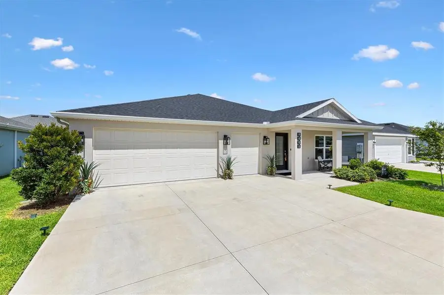 Front exterior of a new home in , The Villages, FL, highlighting curb appeal (Image 2). Front exterior of a new home in , The Villages, FL, highlighting curb appeal (Image 2).