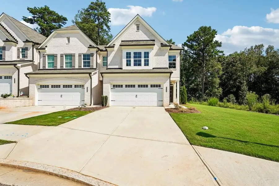 Front exterior of a new home in , Duluth, GA, highlighting curb appeal (Image 2). Front exterior of a new home in , Duluth, GA, highlighting curb appeal (Image 2).