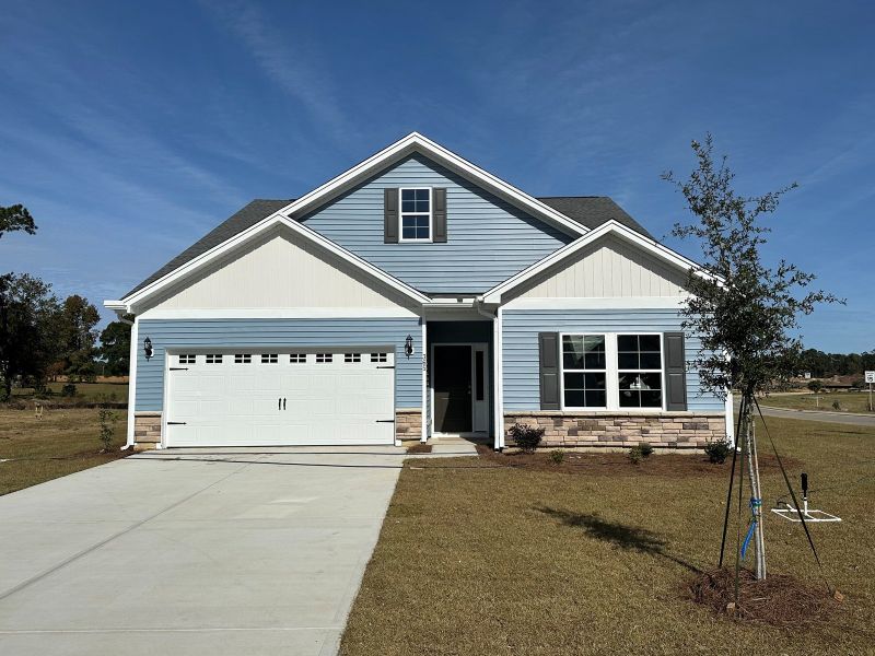Front exterior of a new home in Garden Grove, Conway, SC, highlighting curb appeal (Image 1).