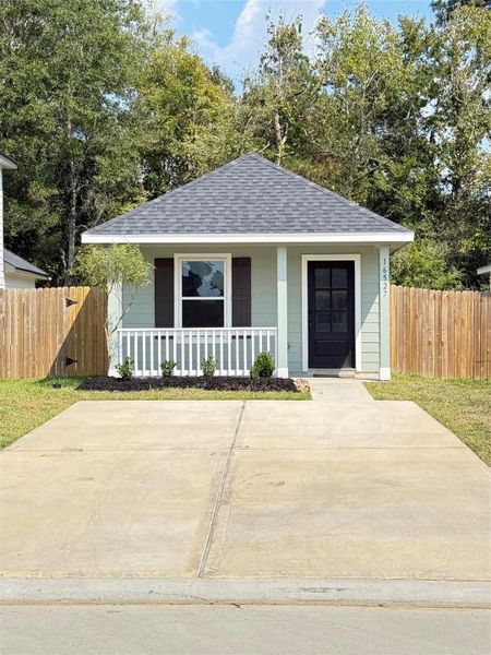 Front exterior of a new home in Marie Village, Conroe, TX, highlighting curb appeal (Image 11). Front exterior of a new home in Marie Village, Conroe, TX, highlighting curb appeal (Image 11).