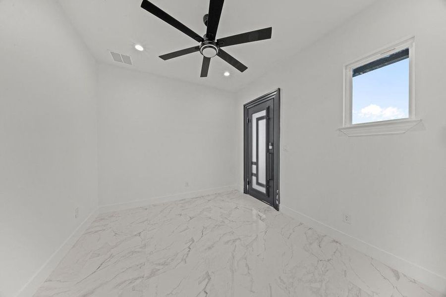 Empty room with light marble finish floors, recessed lighting, and a ceiling fan