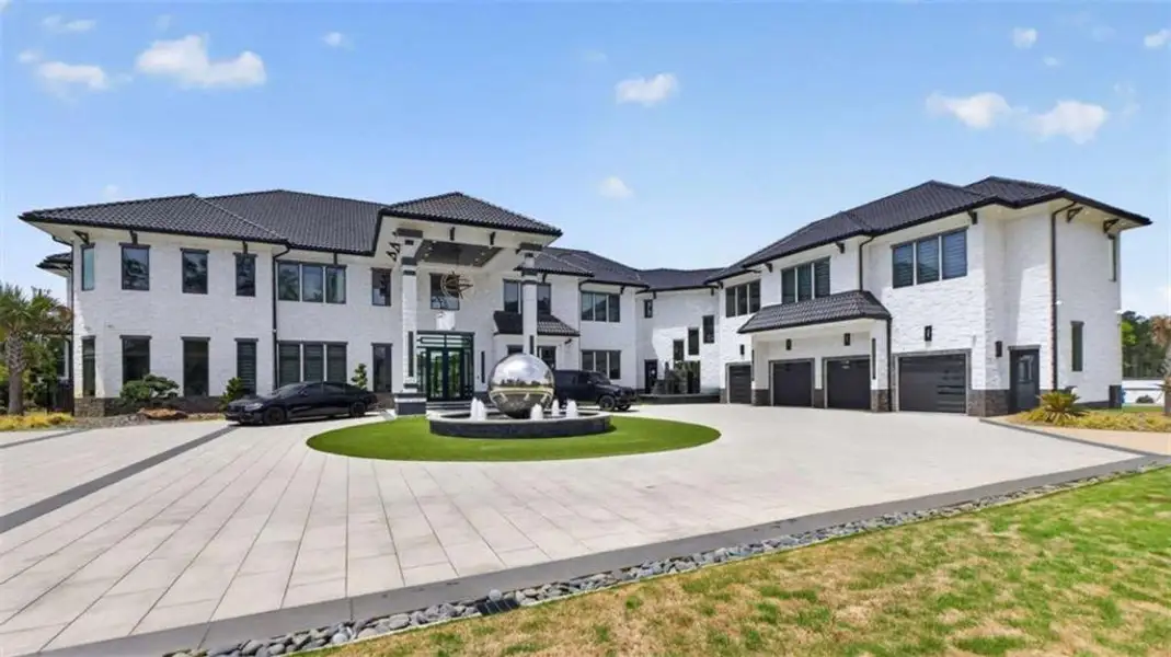 Front exterior of a new home in , Locust Grove, GA, highlighting curb appeal (Image 1). Front exterior of a new home in , Locust Grove, GA, highlighting curb appeal (Image 1).