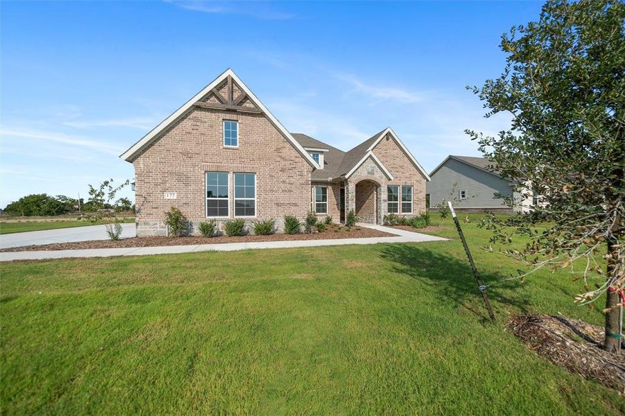 Front exterior of a new home in Fairview Meadows, New Fairview, TX, highlighting curb appeal (Image 15). Front exterior of a new home in Fairview Meadows, New Fairview, TX, highlighting curb appeal (Image 15).