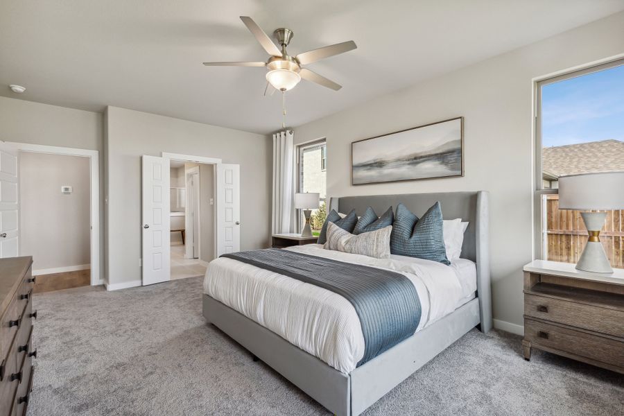 Primary bedroom in the Wimbledon home plan by Trophy Signature Homes – REPRESENTATIVE PHOTO Primary bedroom in the Wimbledon home plan by Trophy Signature Homes – REPRESENTATIVE PHOTO