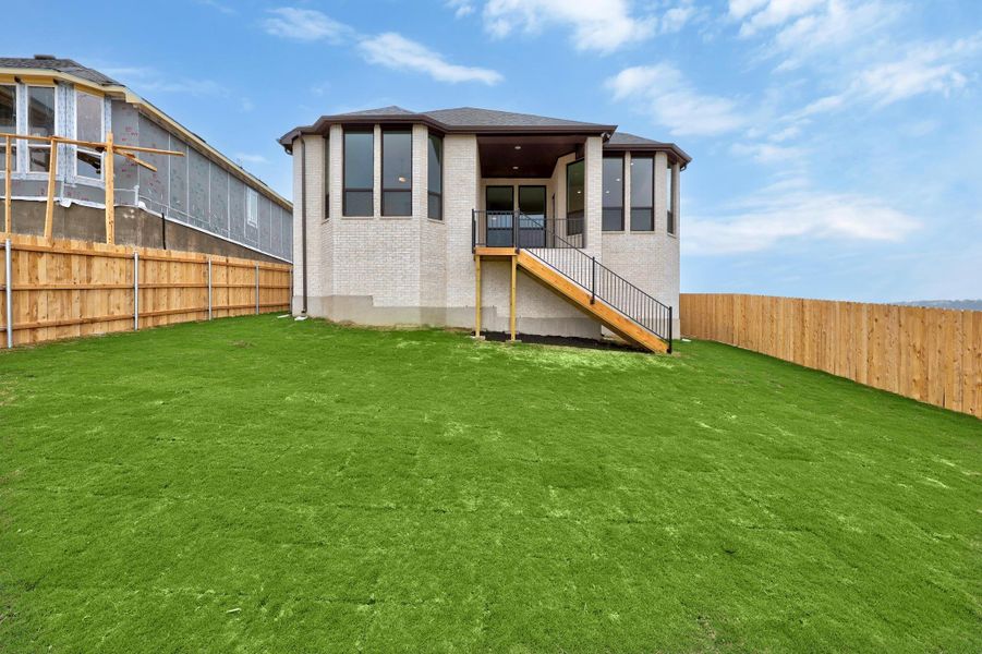 Front exterior of a new home in Lakeside at Tessera on Lake Travis, Lago Vista, TX, highlighting curb appeal (Image 16).