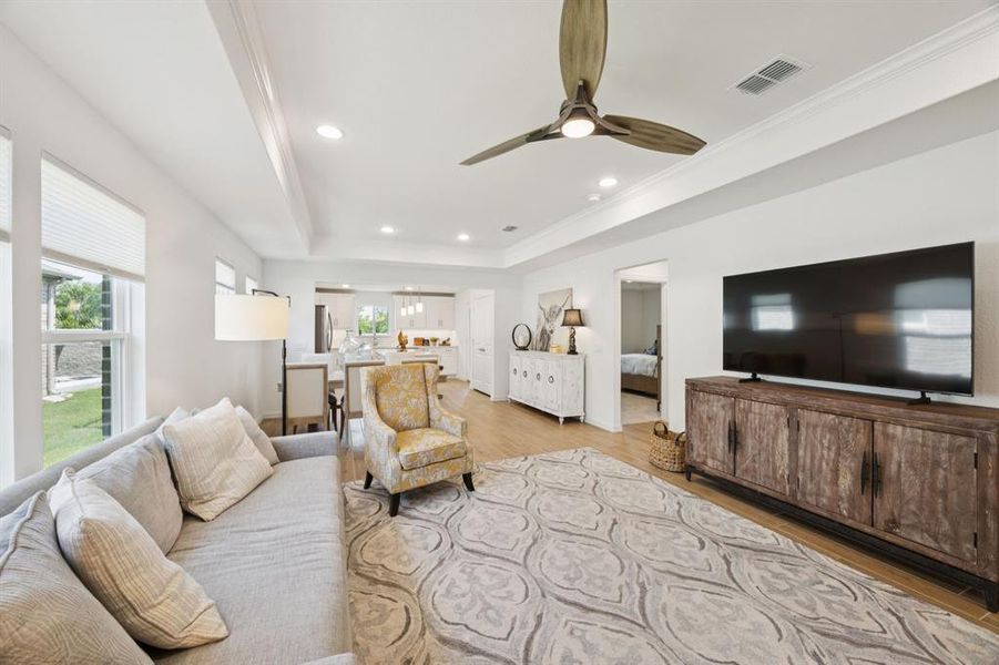 Another view of the living room showing the open flow and abundant light.